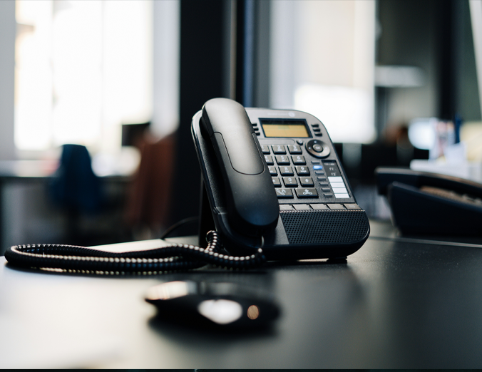 Business team using laptops and headsets on a cloud-based phone system