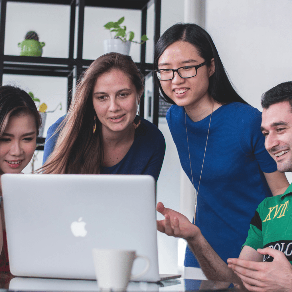 Indiana Telephone Network career team collaborating over a laptop